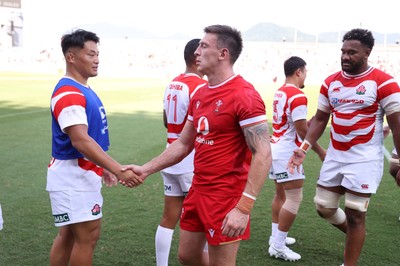 050725 - Japan v Wales - Summer Tour First Test - Josh Adams of Wales shakes hands with the opposition at full time