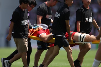 050725 - Japan v Wales - Summer Tour First Test - Ben Carter of Wales is taken off the field injured
