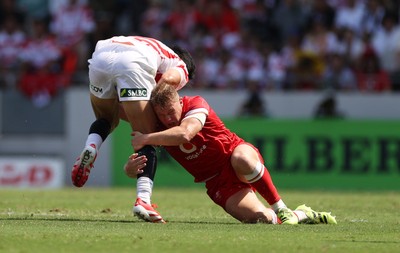 050725 - Japan v Wales - Summer Tour First Test - Sam Costelow of Wales tackles Seungsin Lee of Japan 