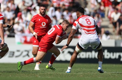 050725 - Japan v Wales - Summer Tour First Test - Sam Costelow of Wales is tackled by Amato Fakatava of Japan 