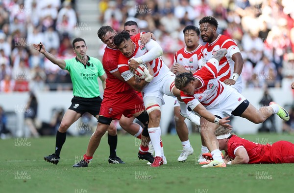 050725 - Japan v Wales - Summer Tour First Test - Ben Gunter of Japan is tackled by Alex Mann of Wales 