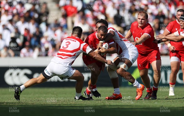 050725 - Japan v Wales - Summer Tour First Test - Liam Belcher of Wales is tackled by Shuhei Takeuchi of Japan 