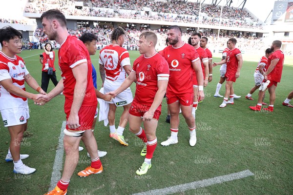 050725 - Japan v Wales - Summer Tour First Test - Sam Costelow of Wales shakes hands with the opposition at full time