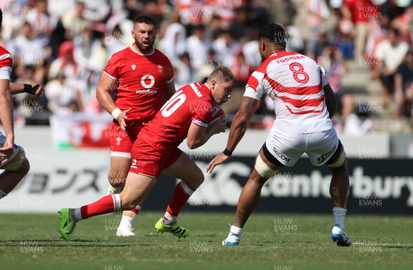 050725 - Japan v Wales - Summer Tour First Test - Sam Costelow of Wales is tackled by Amato Fakatava of Japan 