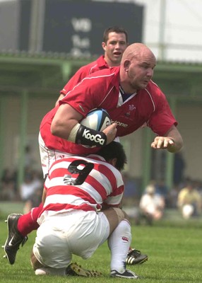 100601 - Japan v Wales - Craig Quinnell bursts through Wataru Murata