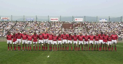 100601 - Japan v Wales - The Wales players observe a minutes silence before their Test match in Osaka for the victims of the 'school stabbings' in the city
