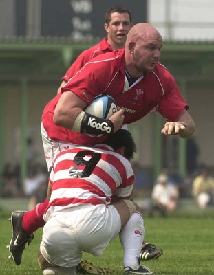 100601 - Japan v Wales - Craig Quinnell bursts through Wataru Murata