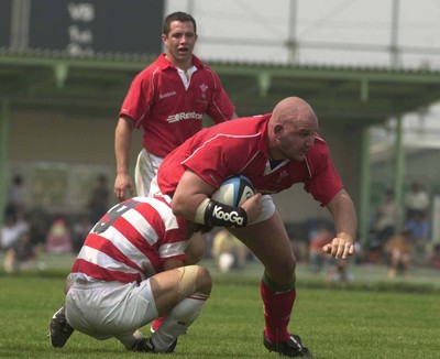 100601 - Japan v Wales - Craig Quinnell bursts through Wataru Murata