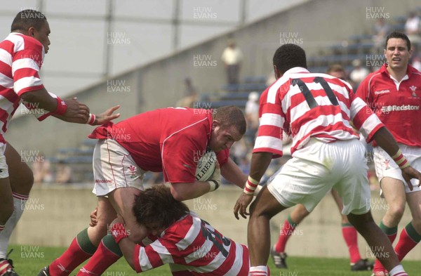 100601 - Japan v Wales - Iestyn Thomas takes the ball into the Japanese defence