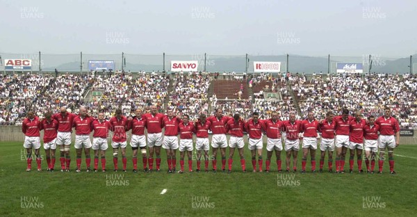 100601 - Japan v Wales - The Wales players observe a minutes silence before their Test match in Osaka for the victims of the 'school stabbings' in the city