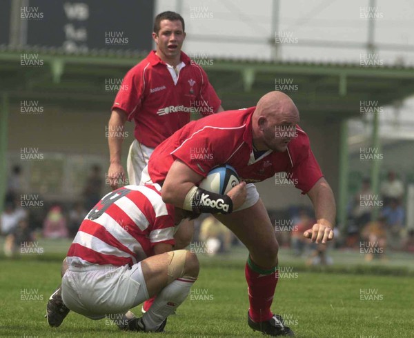 100601 - Japan v Wales - Craig Quinnell bursts through Wataru Murata