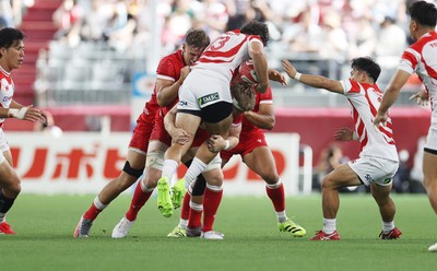 120725 - Japan v Wales - Summer Series - Second Test - Dylan Riley of Japan is tackled by Aaron Wainwright of Wales 