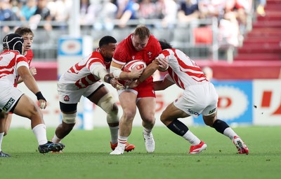 120725 - Japan v Wales - Summer Series - Second Test - Dewi Lake of Wales is tackled by Faulua Makisi and Shogo Nakano of Japan 