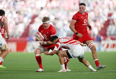 120725 - Japan v Wales - Summer Series - Second Test - Aaron Wainwright of Wales is tackled by Seungsin Lee of Japan 