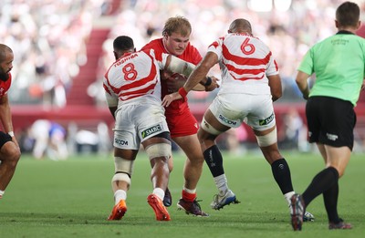 120725 - Japan v Wales - Summer Series - Second Test - Archie Griffin of Wales is tackled by Faulua Makisi of Japan 