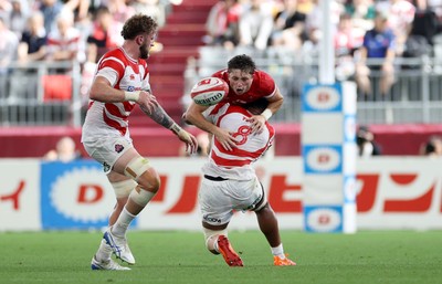 120725 - Japan v Wales - Summer Series - Second Test - Dan Edwards of Wales is tackled by Faulua Makisi of Japan 