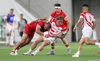 120725 - Japan v Wales - Summer Series - Second Test - Halatoa Vailea of Japan is tackled by Josh Macleod of Wales 