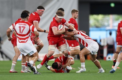 120725 - Japan v Wales - Summer Series - Second Test - Aaron Wainwright of Wales is tackled by Shuhei Takeuchi and Hayate Era of Japan 