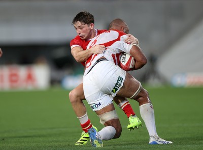 120725 - Japan v Wales - Summer Series - Second Test - Faulua Makisi of Japan is tackled by Dan Edwards of Wales 