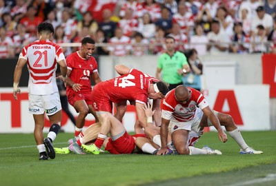 120725 - Japan v Wales - Summer Series - Second Test - Dan Edwards of Wales celebrates scoring a try with team mates]