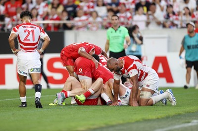 120725 - Japan v Wales - Summer Series - Second Test - Dan Edwards of Wales celebrates scoring a try with team mates]