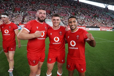 120725 - Japan v Wales - Summer Series - Second Test - Gareth Thomas, Reuben Morgan-Williams and Keelan Giles of Wales celebrate at full time