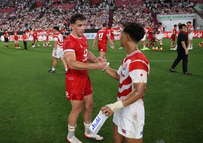 120725 - Japan v Wales - Summer Series - Second Test - Kieran Hardy of Wales shakes hands with the opposition