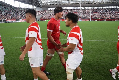 120725 - Japan v Wales - Summer Series - Second Test - Teddy Williams of Wales shakes hands with the opposition