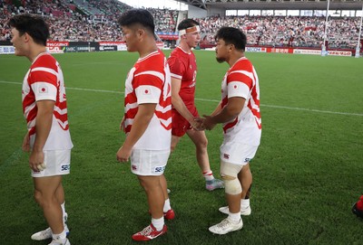 120725 - Japan v Wales - Summer Series - Second Test - Tom Rogers of Wales shakes hands with the opposition