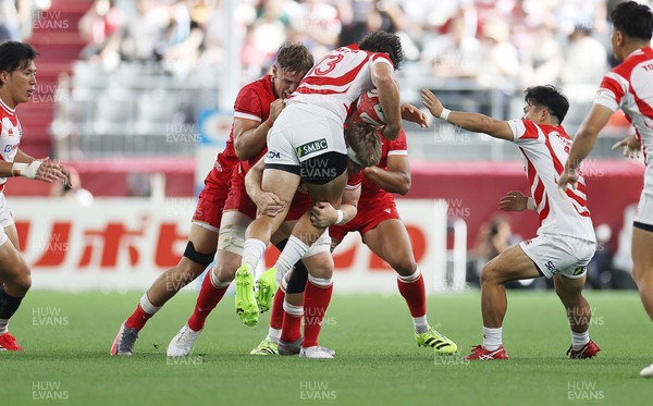 120725 - Japan v Wales - Summer Series - Second Test - Dylan Riley of Japan is tackled by Aaron Wainwright of Wales 