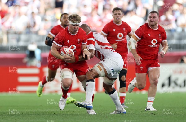 120725 - Japan v Wales - Summer Series - Second Test - Aaron Wainwright of Wales is tackled by Michael Leitch of Japan 