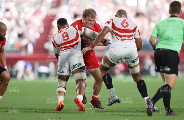 120725 - Japan v Wales - Summer Series - Second Test - Archie Griffin of Wales is tackled by Faulua Makisi of Japan 