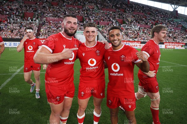 120725 - Japan v Wales - Summer Series - Second Test - Gareth Thomas, Reuben Morgan-Williams and Keelan Giles of Wales celebrate at full time