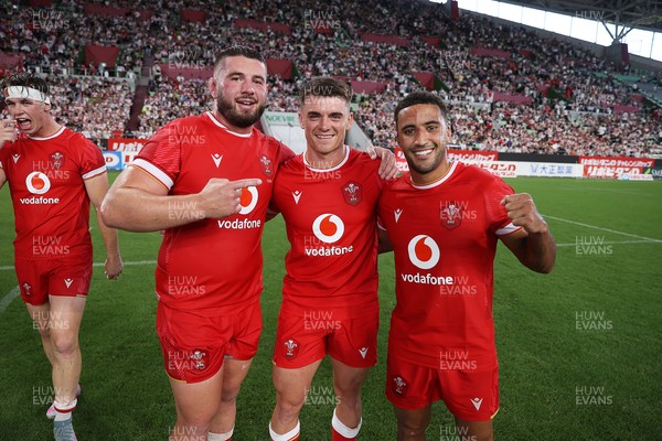 120725 - Japan v Wales - Summer Series - Second Test - Gareth Thomas, Reuben Morgan-Williams and Keelan Giles of Wales celebrate at full time