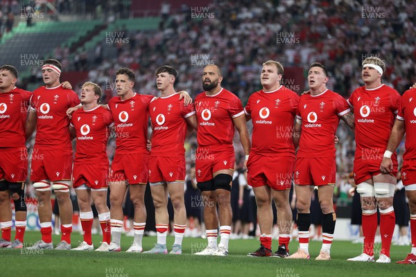 120725 - Japan v Wales - Summer Series - Second Test - Freddie Thomas, Blair Murray, Kieran Hardy, Tom Rogers, Josh Macleod, Archie Griffin, Josh Adams and Taine Plumtree sing the anthem