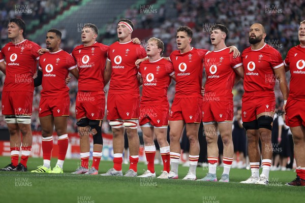120725 - Japan v Wales - Summer Series - Second Test - Teddy Williams, Ben Thomas, Alex Mann, Freddie Thomas, Blair Murray, Kieran Hardy, Tom Rogers and Josh Macleod sing the anthem
