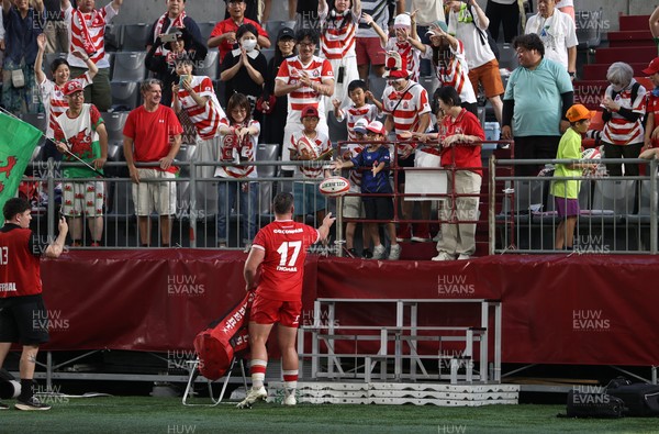 120725 - Japan v Wales - Summer Series - Second Test - Gareth Thomas of Wales hands out balls to the crowd