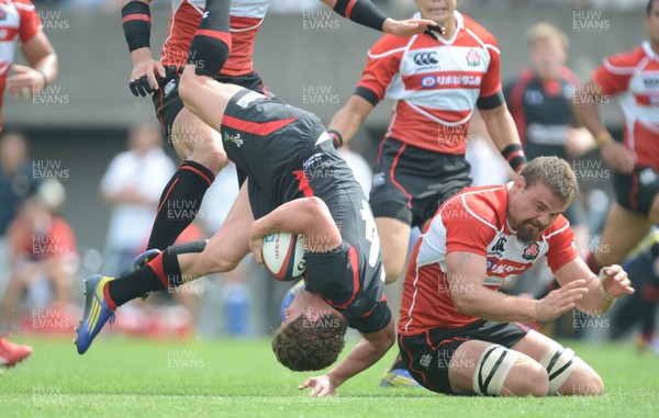 150613 - Japan v Wales -Harry Robinson of Wales is tackled by Michael Broadhurst of Japan