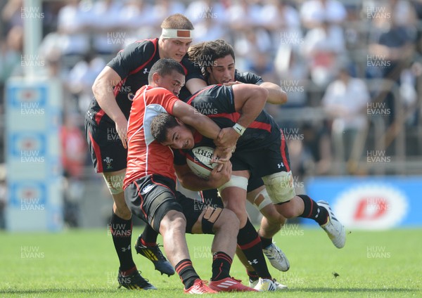 150613 - Japan v Wales -Andries Pretorius of Wales is tackled by Hendrik Tui of Japan