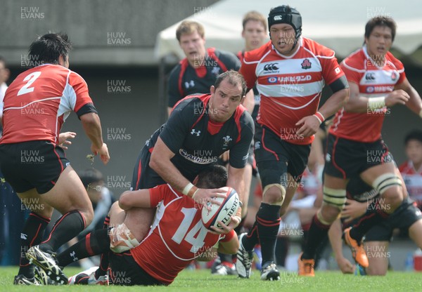 150613 - Japan v Wales -Lou Reed of Wales is tackled by Toshiaki Hirose of Japan