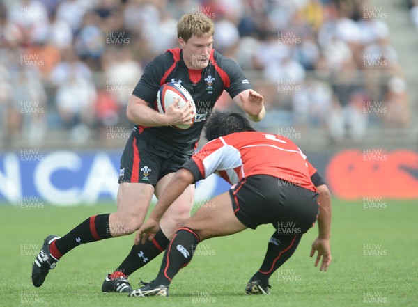 150613 - Japan v Wales -Jonathan Spratt of Wales takes on Shota Horie of Japan