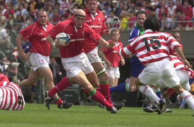 170601- Japan v Wales - Nathan Budgett tries to run around Hirotoki Onozawa