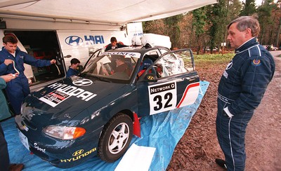 211197 - Jimmy McRae at the Hyundai service area with his car ahead of the RAC Rally