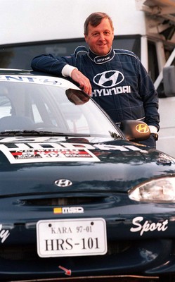 211197 - Jimmy McRae at the Hyundai service area with his car ahead of the RAC Rally