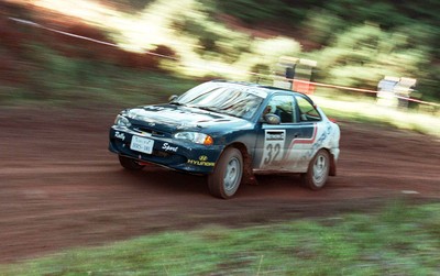 211197 - Jimmy McRae at the Hyundai service area with his car ahead of the RAC Rally