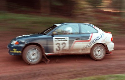 211197 - Jimmy McRae at the Hyundai service area with his car ahead of the RAC Rally