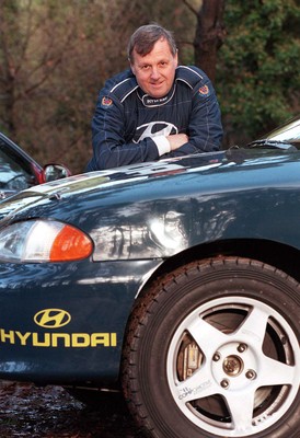 211197 - Jimmy McRae at the Hyundai service area with his car ahead of the RAC Rally