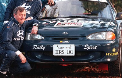 211197 - Jimmy McRae at the Hyundai service area with his car ahead of the RAC Rally