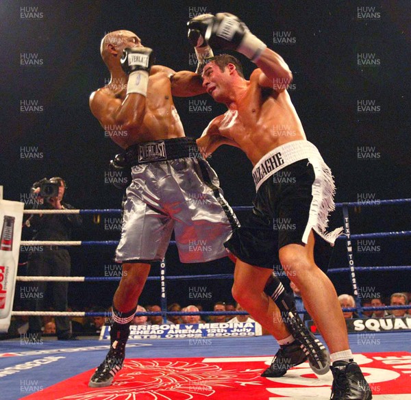 280603 - Joe Calzaghe v Byron Mitchell - WBO Super-Middleweight World Championship - Joe Calzaghe (right) and Byron Mitchell trade punches