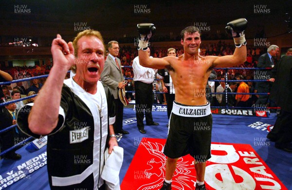 280603 - Joe Calzaghe v Byron Mitchell - WBO Super-Middleweight World Championship - Joe Calzaghe (right) and father Enzo celebrate